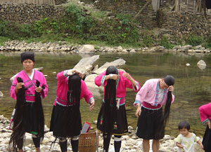 Yao women washing their longest hair in the world